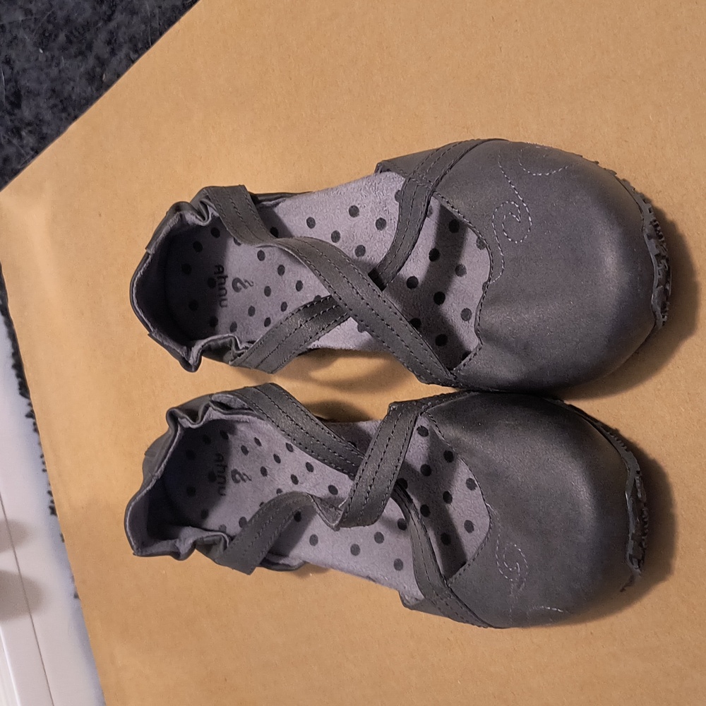 Cute never worn women's size  7.5 vegan leather cross strap flats.  Lightweight